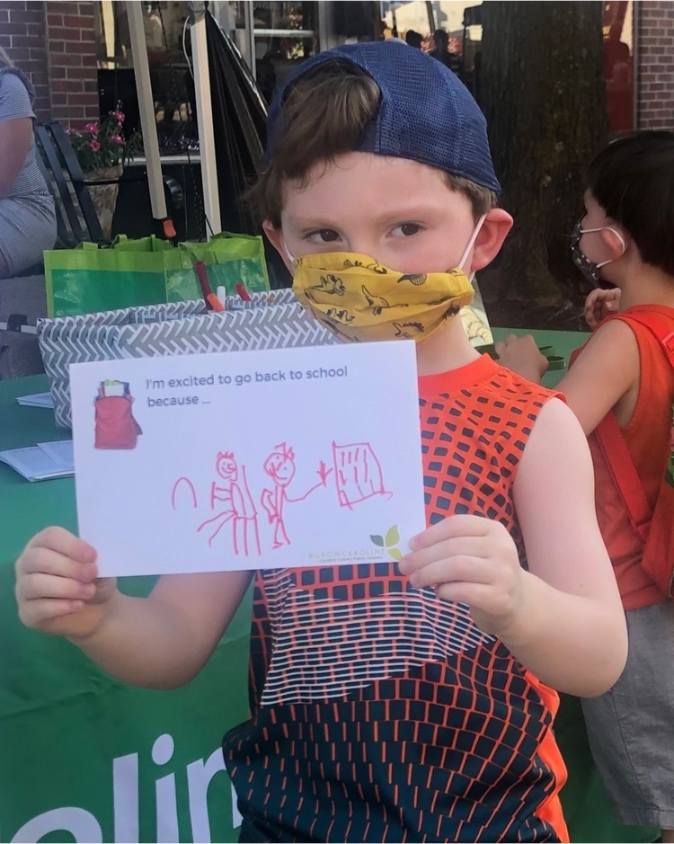little boy with mask and drawing