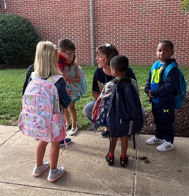 teacher talking to students