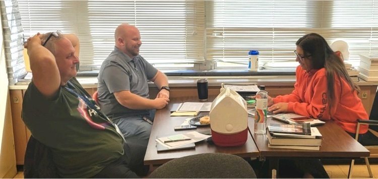 adults at table working