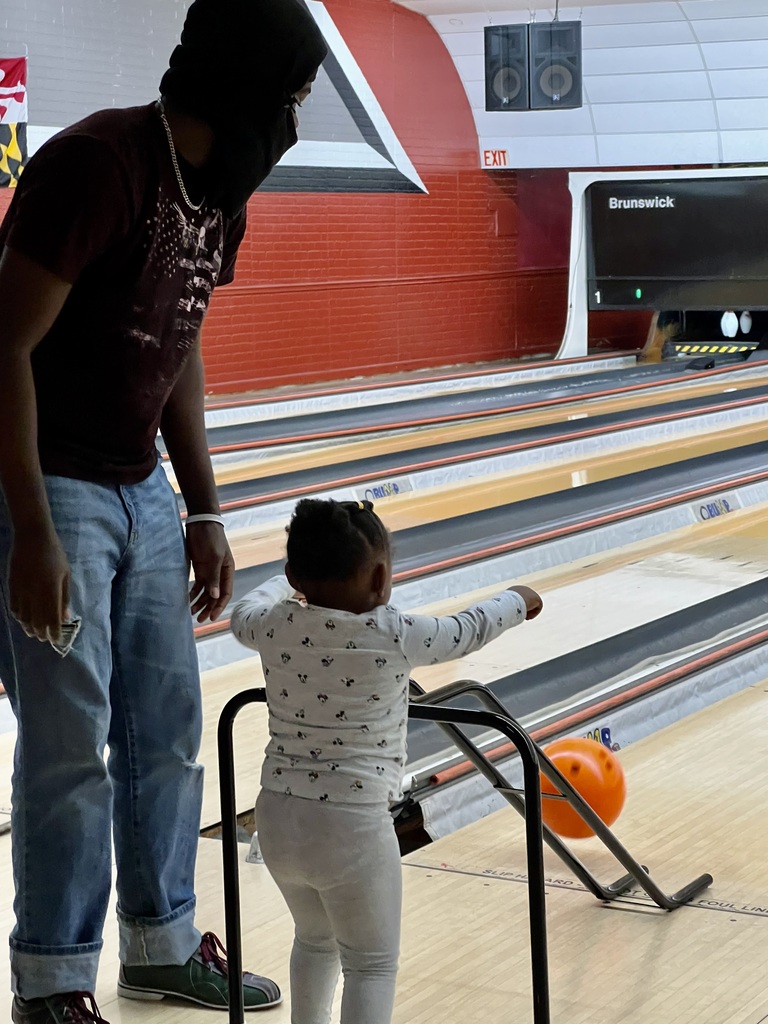 adult and child bowling