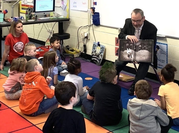adult reading to children